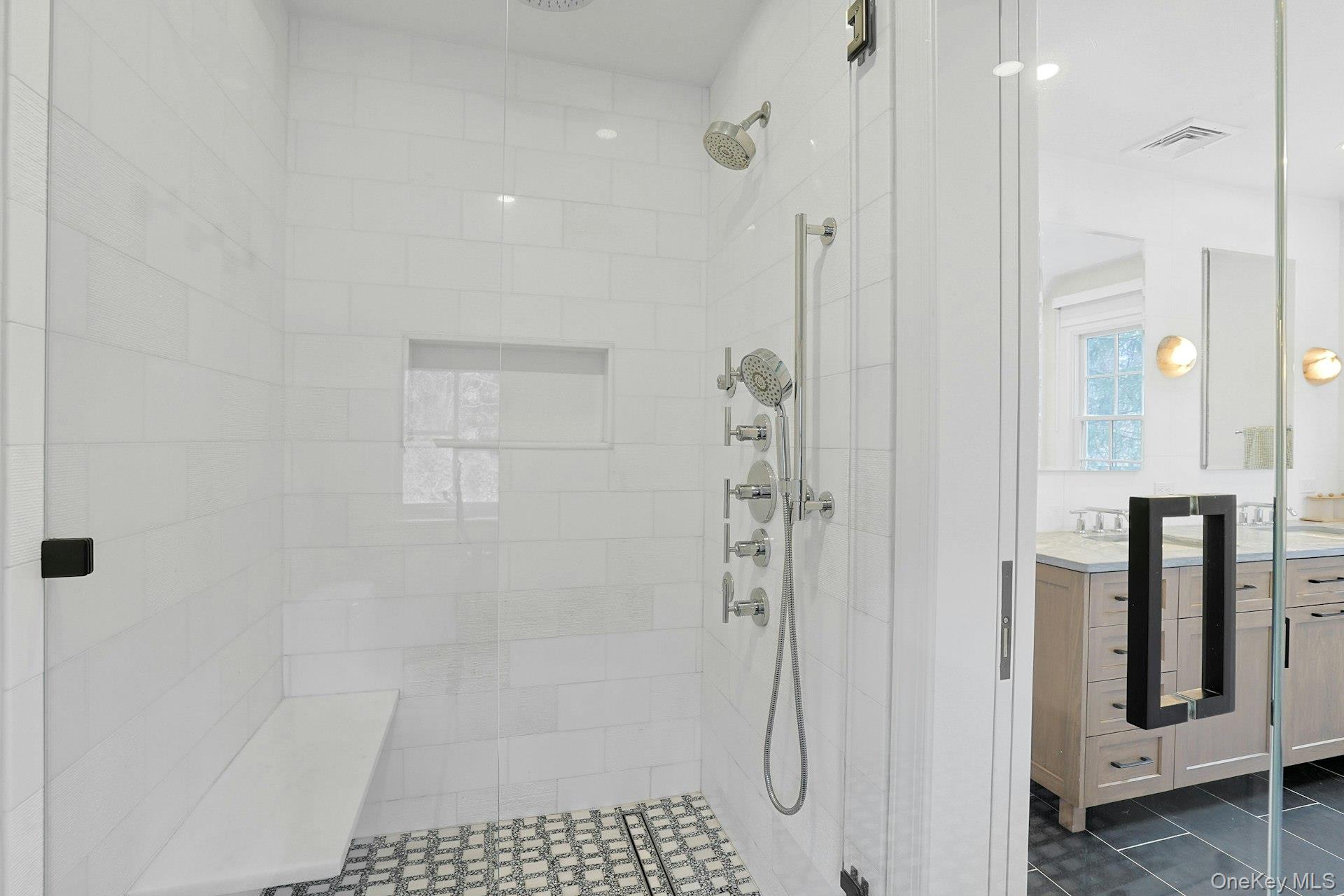 21 Tisdale Road Scarsdale, NY 10583 - Photo 20 of 40 A closer view of the large, refined primary ensuite glass-enclosed shower.
