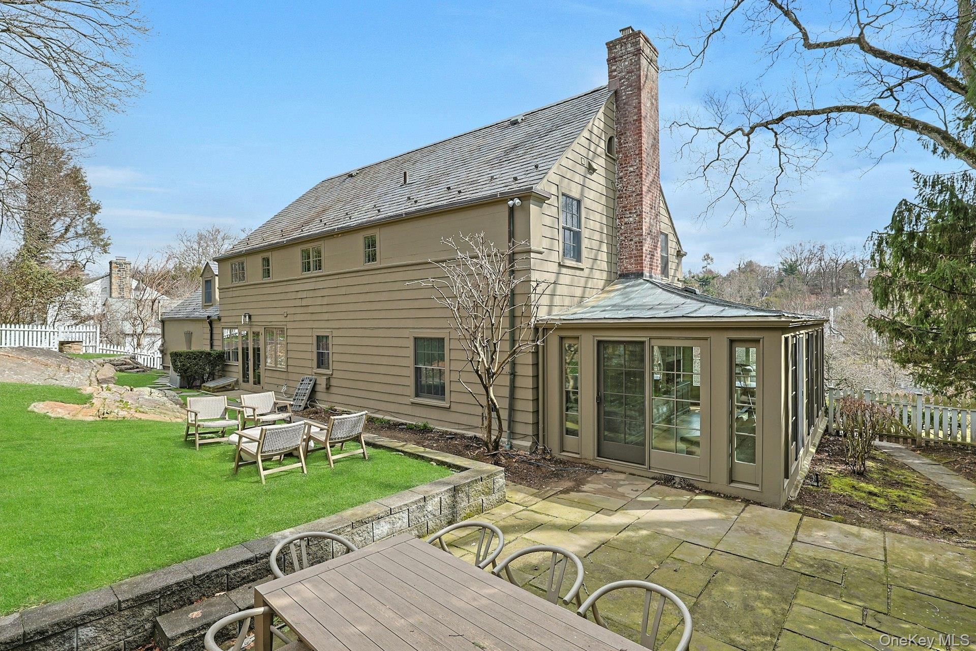 21 Tisdale Road Scarsdale, NY 10583 - Photo 31 of 40 Seamless connection to the outdoors with the spacious patio accessed from the sunroom and the kitchen.