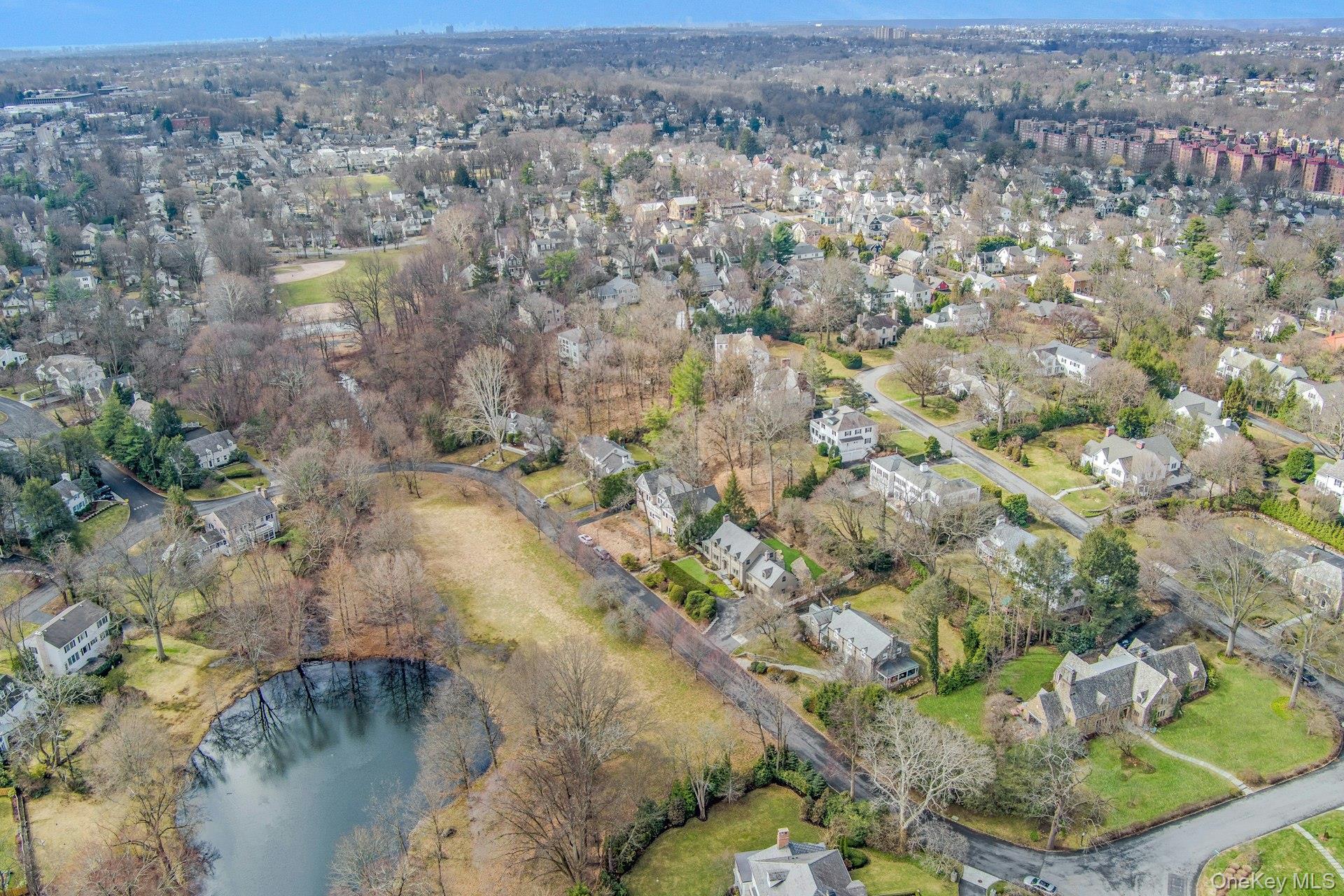 21 Tisdale Road Scarsdale, NY 10583 - Photo 35 of 40 A view of the pond with Hyatt Park and playground just beyond, only a couple of minutes away by way of a wood chip access path around the corner from this home.