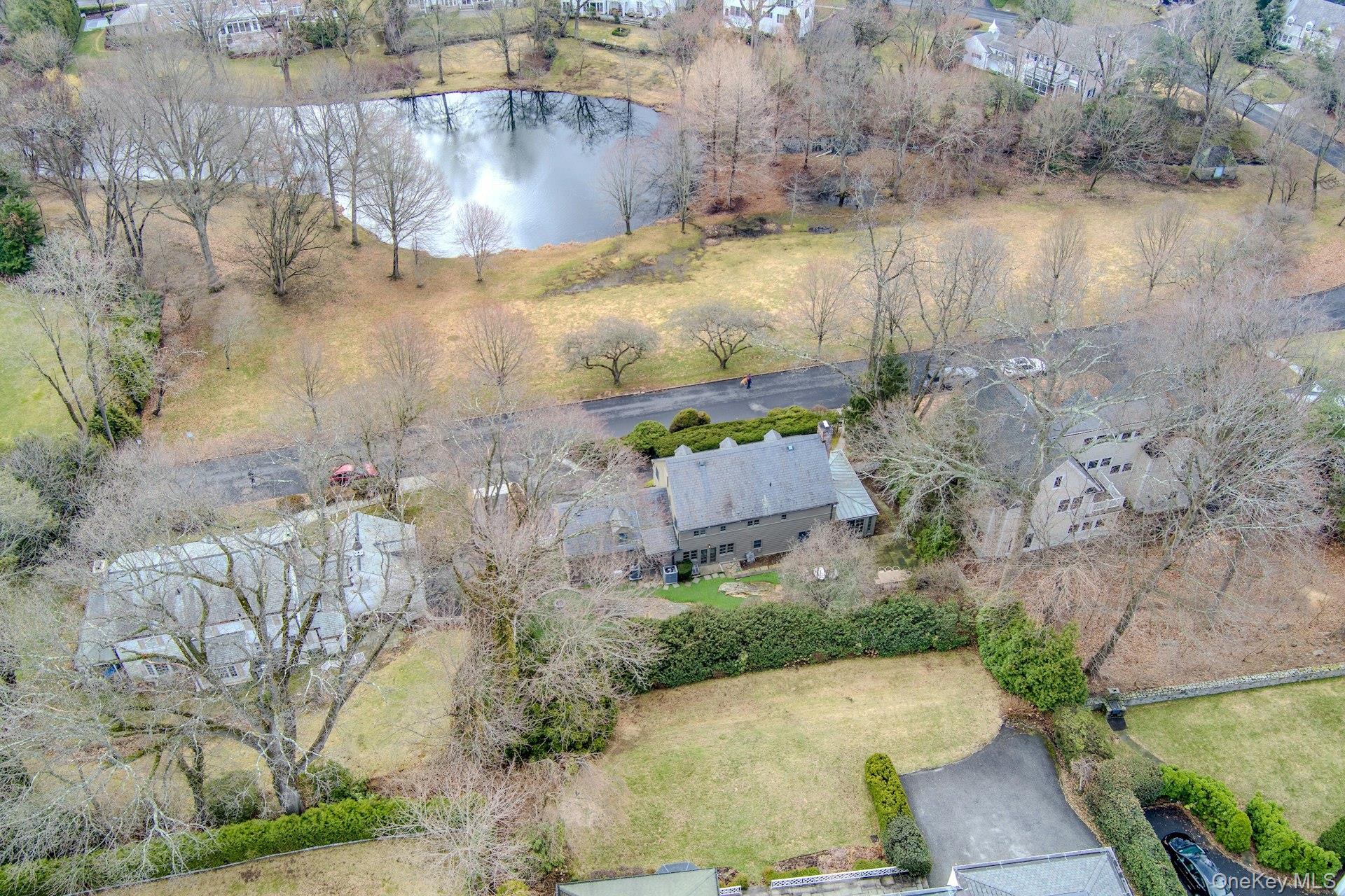 21 Tisdale Road Scarsdale, NY 10583 - Photo 36 of 40 Live on the park -- enjoy this view of the pond from your home providing a Central Park feel in the suburbs.