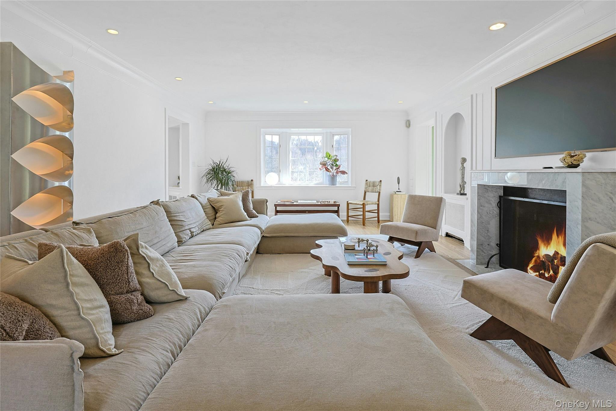 21 Tisdale Road Scarsdale, NY 10583 - Photo 4 of 40 Enjoy breathtaking views of Crane Berkley Pond from the bay window in this chic living room.