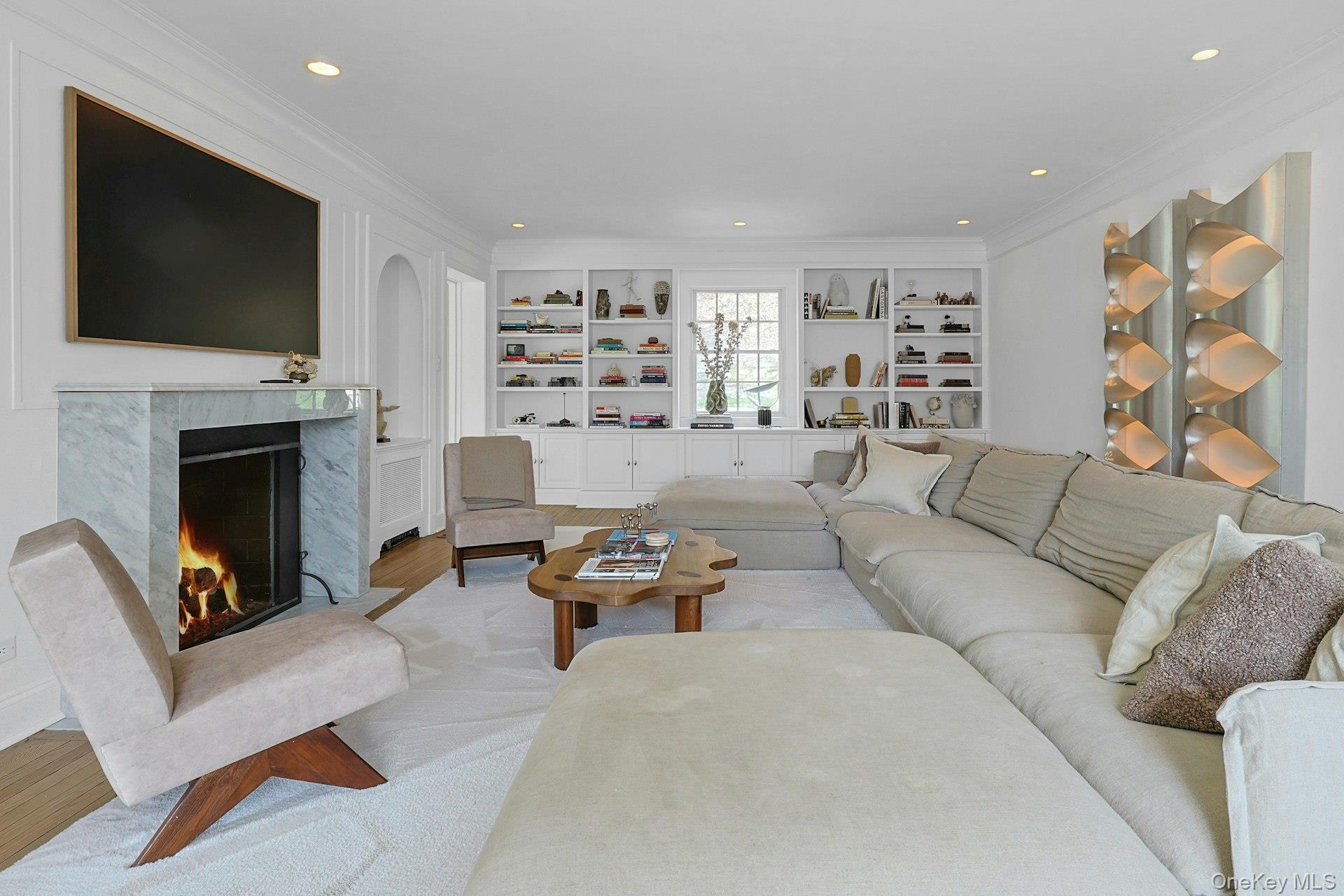 21 Tisdale Road Scarsdale, NY 10583 - Photo 6 of 40 A closer view of the chic living room showcasing the custom built-ins.