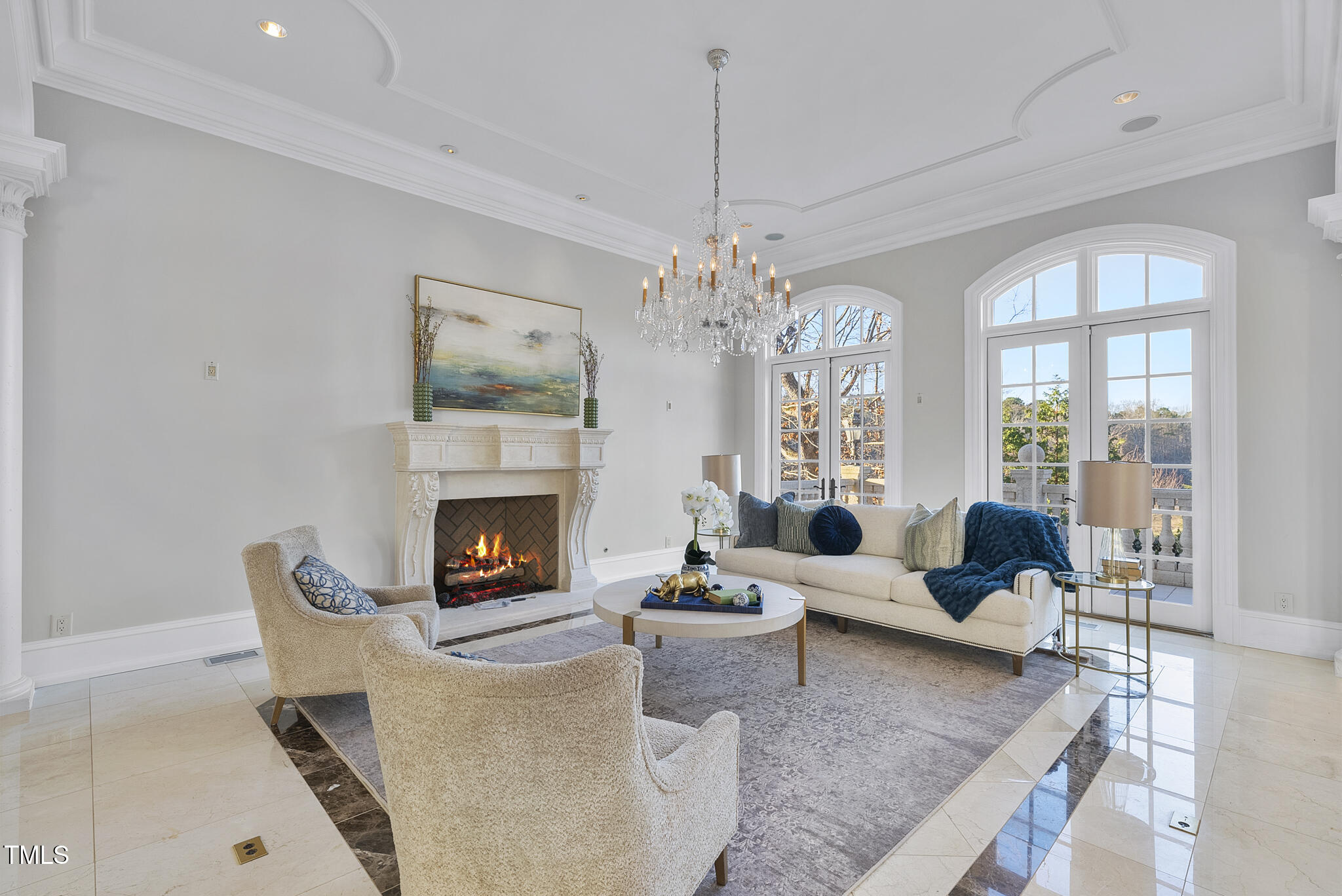 1404 Barony Lake Way Raleigh, NC 27614 - Photo 9 of 52 a living room with furniture a fireplace and chandelier