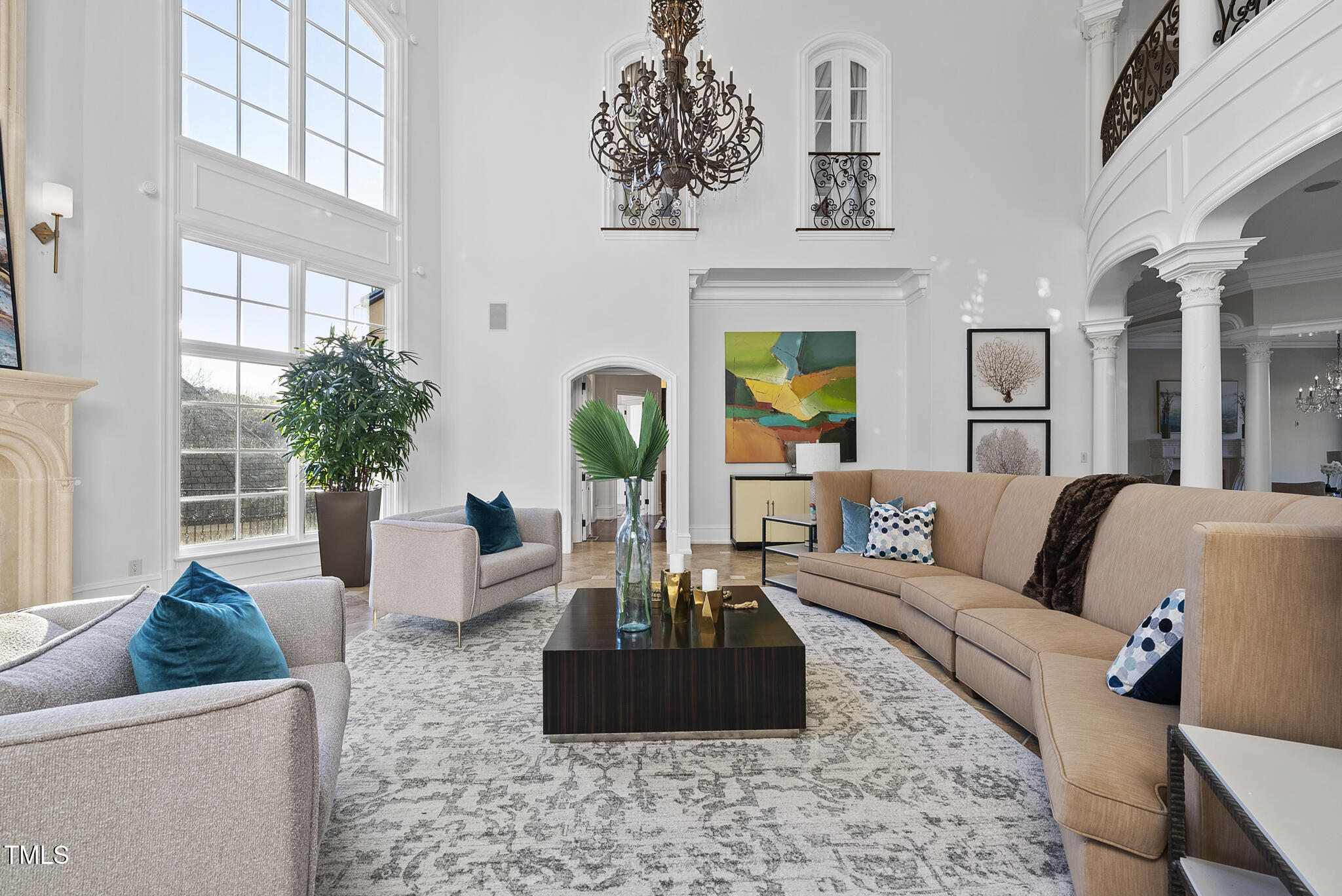 1404 Barony Lake Way Raleigh, NC 27614 - Photo 10 of 52 a living room with furniture a chandelier and a table