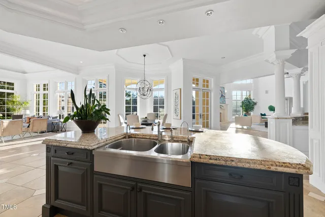 a kitchen with a table and chairs in it