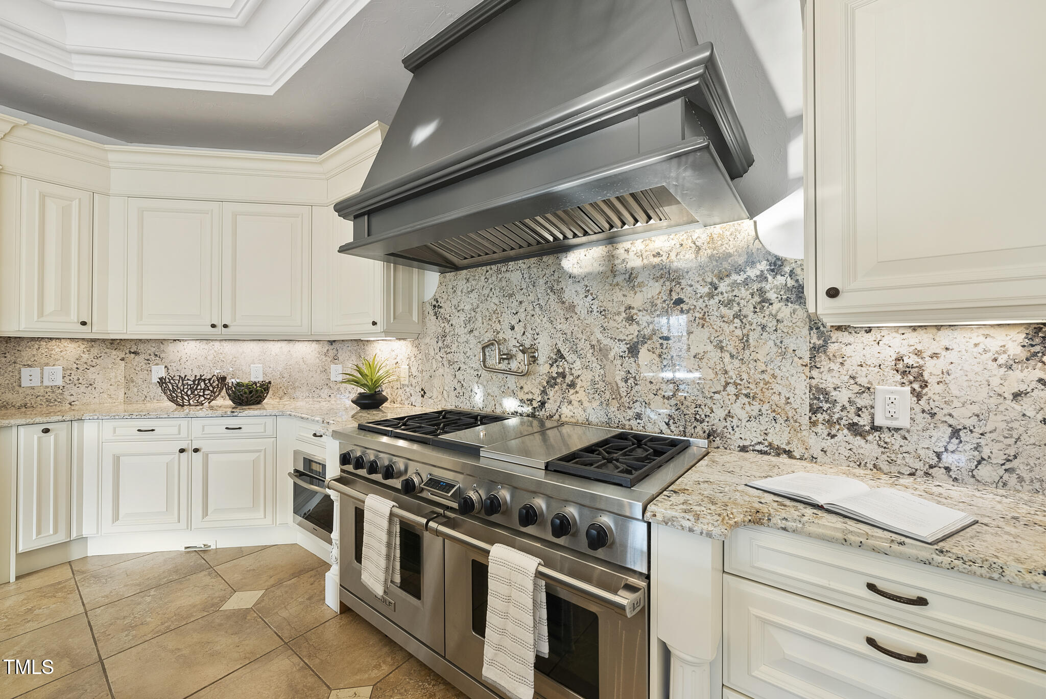 1404 Barony Lake Way Raleigh, NC 27614 - Photo 18 of 52 a stove top oven sitting inside of a kitchen