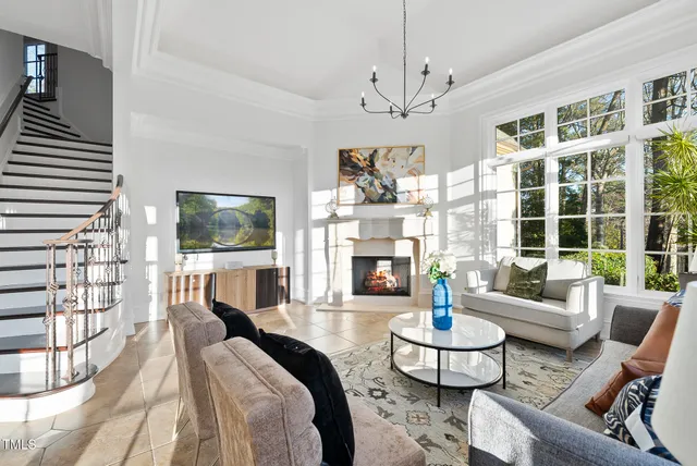 a kitchen with stainless steel appliances granite countertop a stove a sink and white cabinets