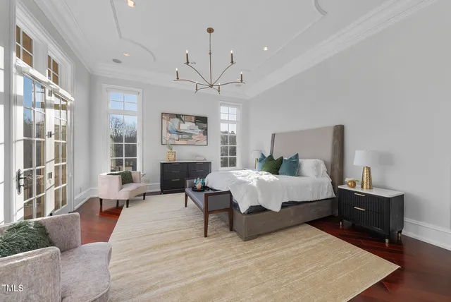 a bed room with a bed and a chair