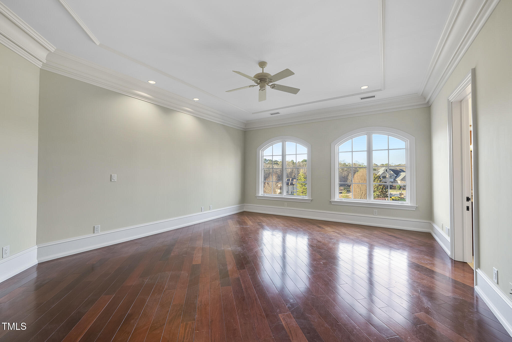 1404 Barony Lake Way Raleigh, NC 27614 - Photo 27 of 52 a view of an empty room with wooden floor and a window