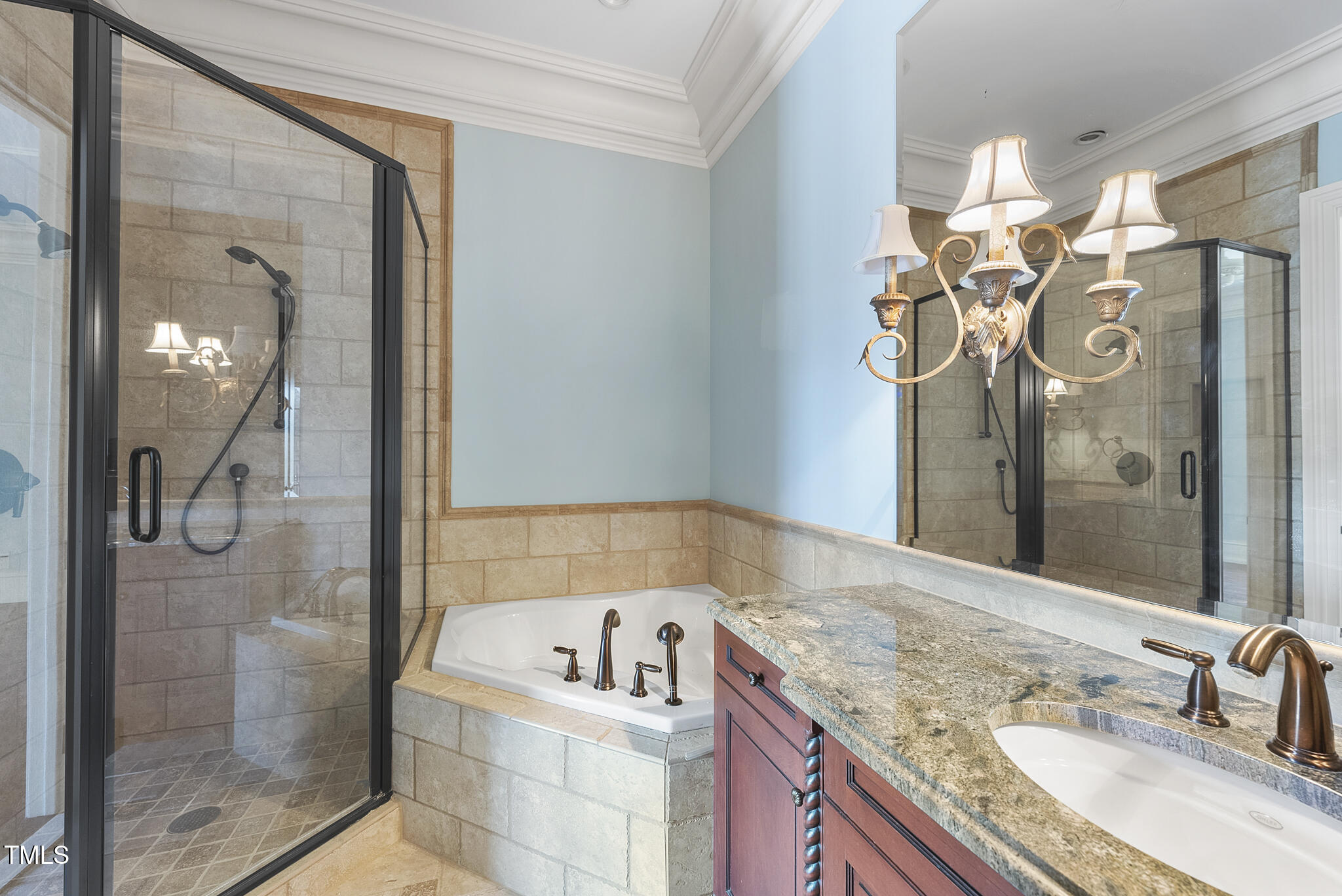 1404 Barony Lake Way Raleigh, NC 27614 - Photo 30 of 52 a bathroom with a granite countertop sink a mirror and a shower