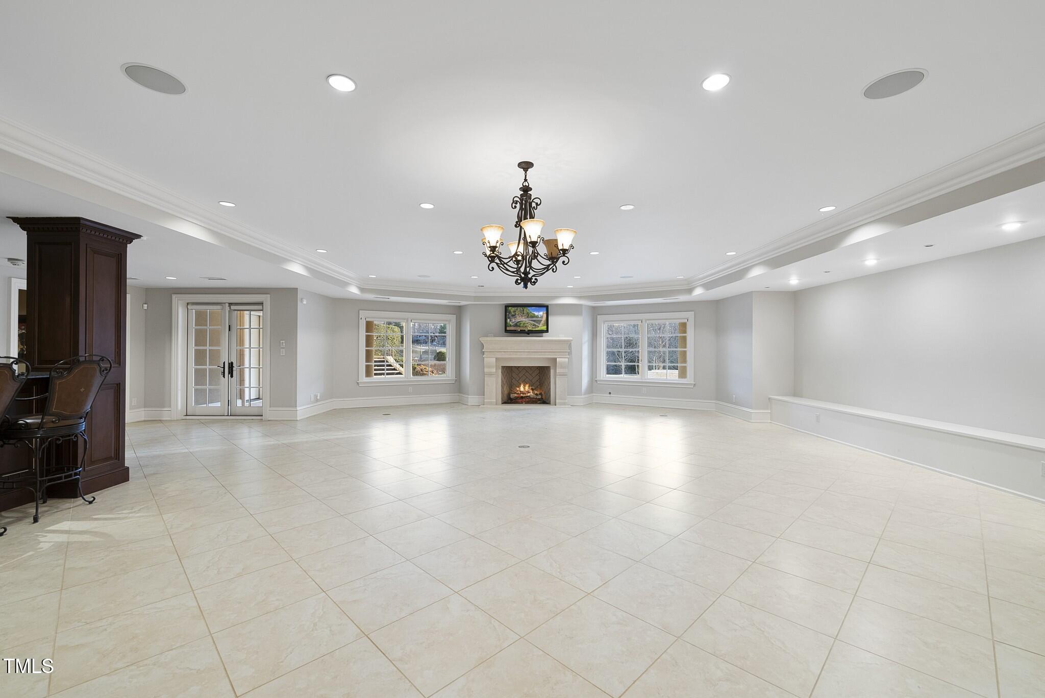 1404 Barony Lake Way Raleigh, NC 27614 - Photo 35 of 52 a view of an empty room with a kitchen and a window