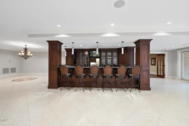 a room with furniture pool table gym equipment