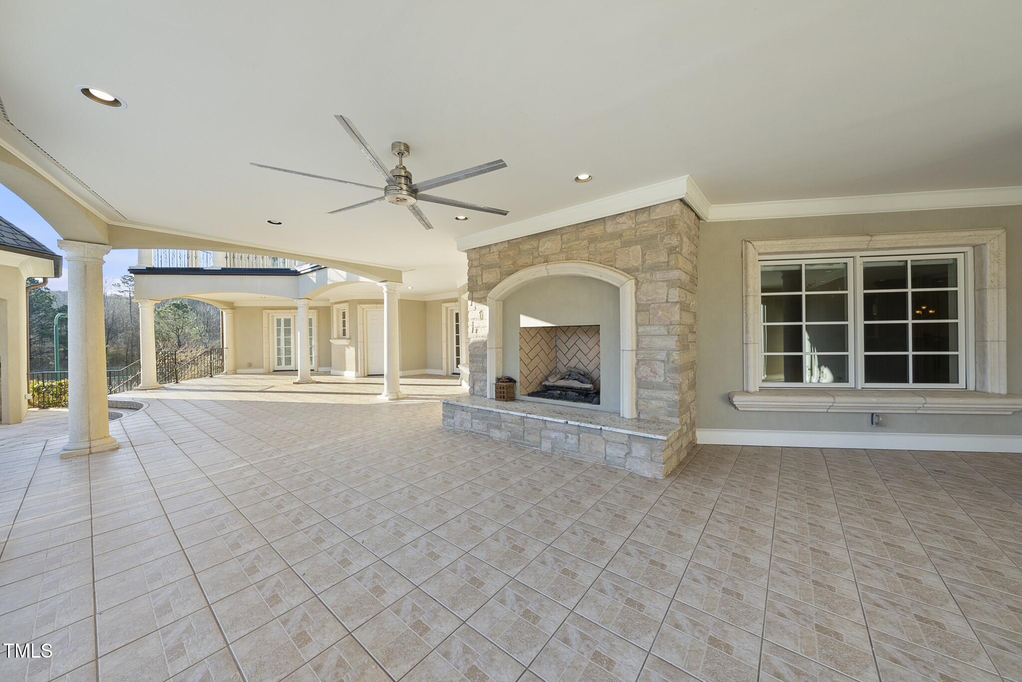 1404 Barony Lake Way Raleigh, NC 27614 - Photo 39 of 52 a view of an empty room with a fireplace and a large window