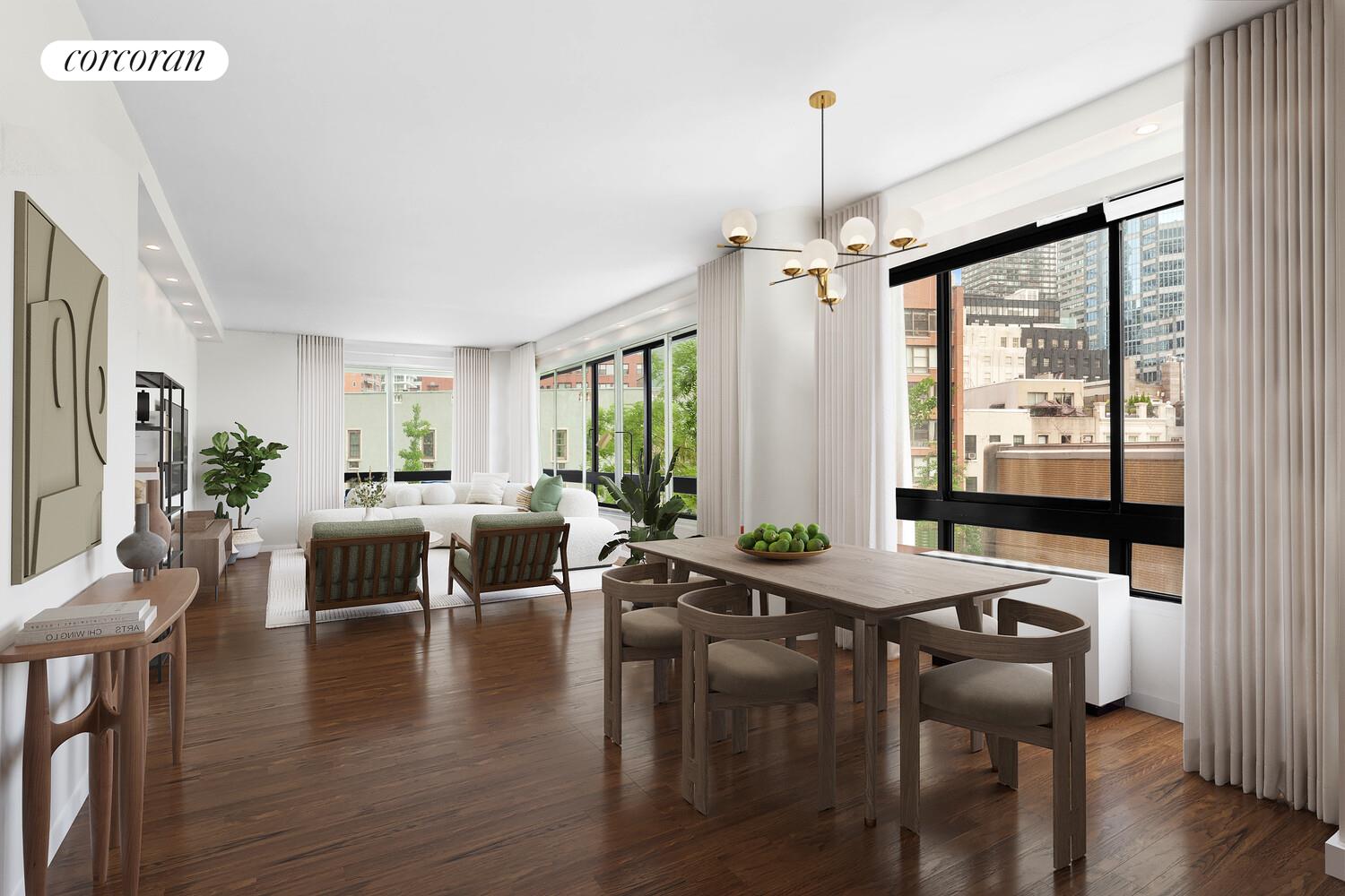 a view of a livingroom with furniture window and wooden floor