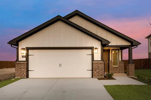 a front view of a house with garage