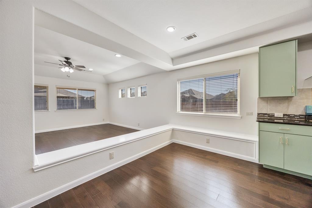 4104 Gaillardia Way Forney, TX 75126 - Photo 13 of 34 a view of an empty room with a window and wooden floor