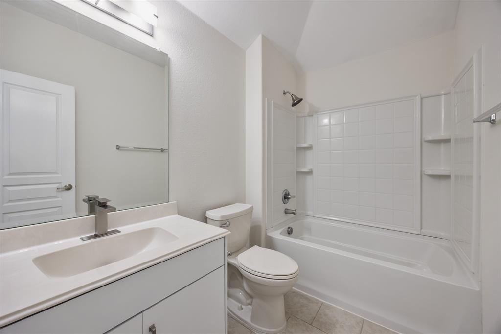 4104 Gaillardia Way Forney, TX 75126 - Photo 14 of 34 a bathroom with a sink toilet vanity and shower