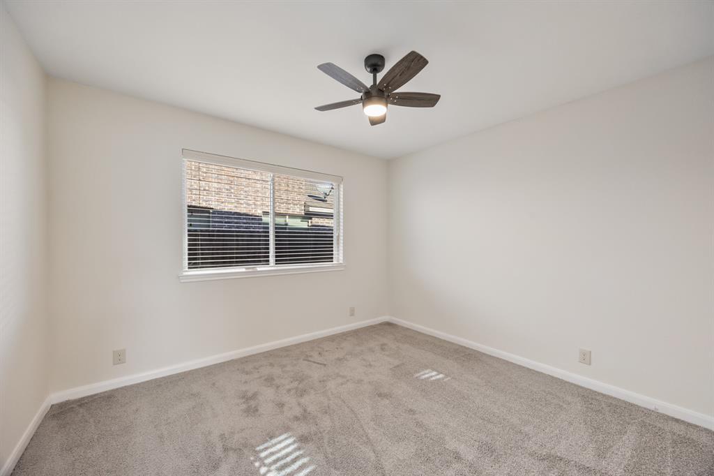 4104 Gaillardia Way Forney, TX 75126 - Photo 22 of 34 an empty room with a window and a fan