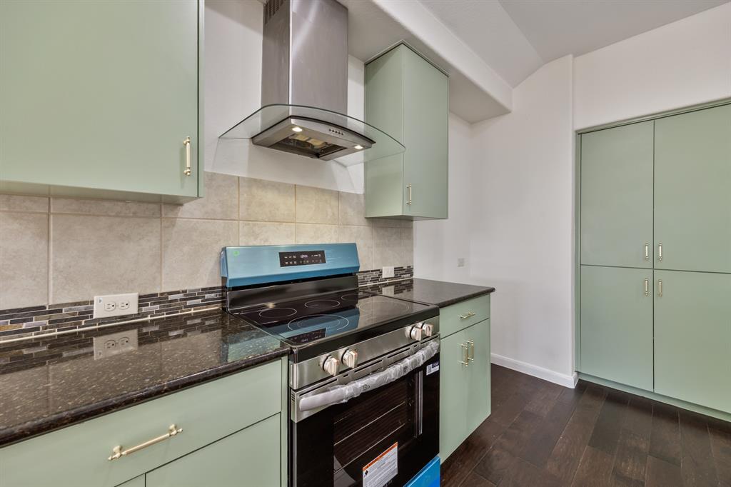4104 Gaillardia Way Forney, TX 75126 - Photo 5 of 34 a kitchen with stainless steel appliances granite countertop a sink stove and cabinets