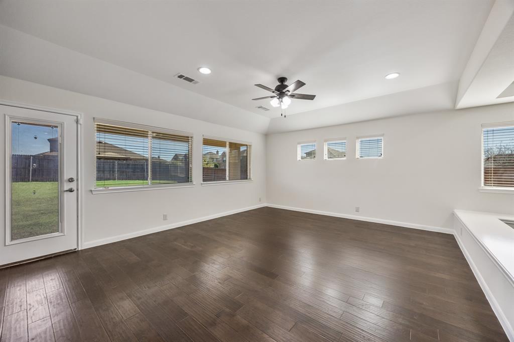 4104 Gaillardia Way Forney, TX 75126 - Photo 9 of 34 a view of an empty room with a window and wooden floor