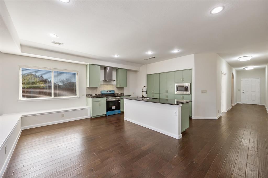 4104 Gaillardia Way Forney, TX 75126 - Photo 10 of 34 a view of kitchen with wooden floor and electronic appliances