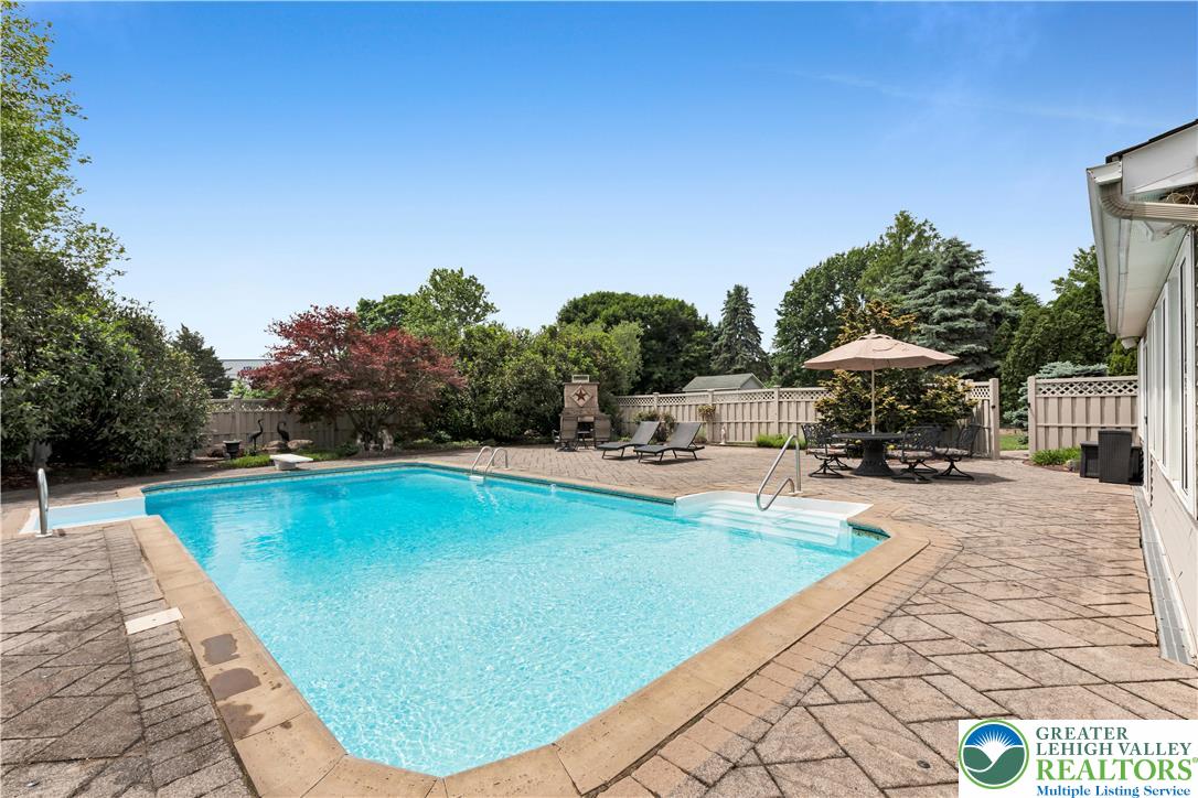 3830 McIntosh Drive Orefield, PA 18069 - Photo 27 of 36 a swimming pool with an outdoor seating