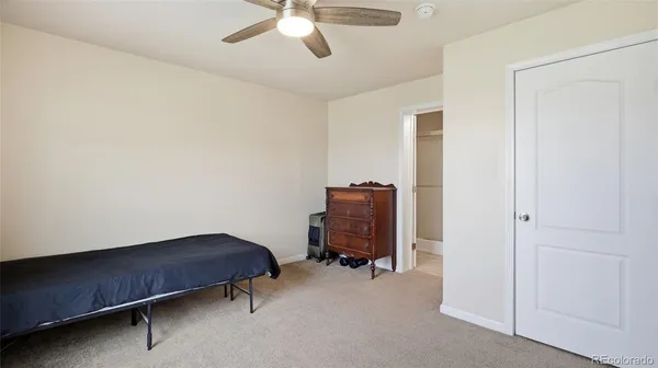 a room with a chair and gym equipment