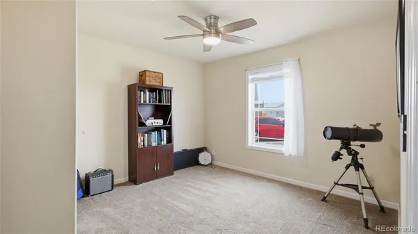 a view of room with workspace and windows