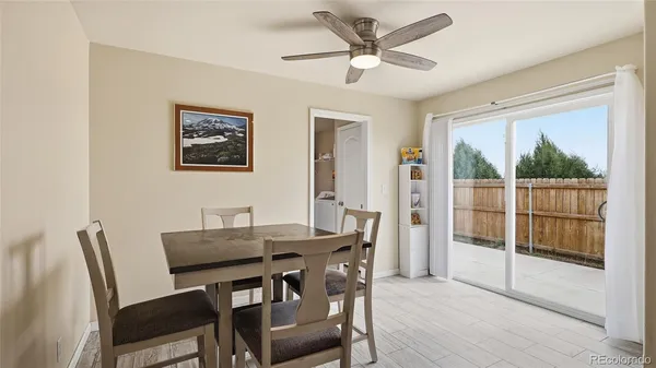 a dining room with furniture and window