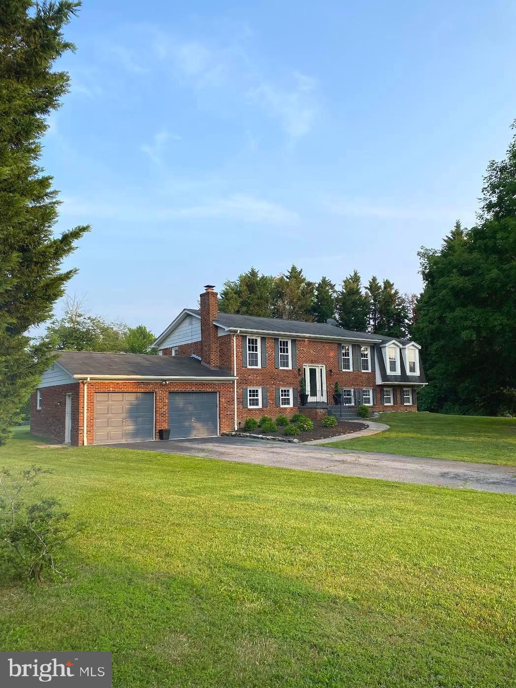 37715 Apache Road Charlotte Hall, MD 20622 - Photo 2 of 35 a front view of a house with a garden