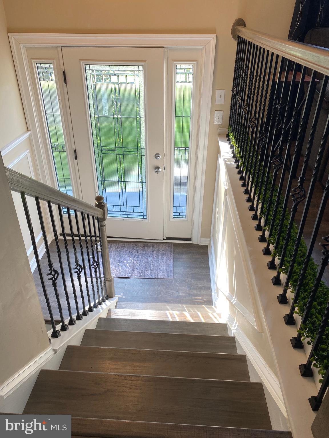 37715 Apache Road Charlotte Hall, MD 20622 - Photo 24 of 35 a view of staircase with open kitchen view