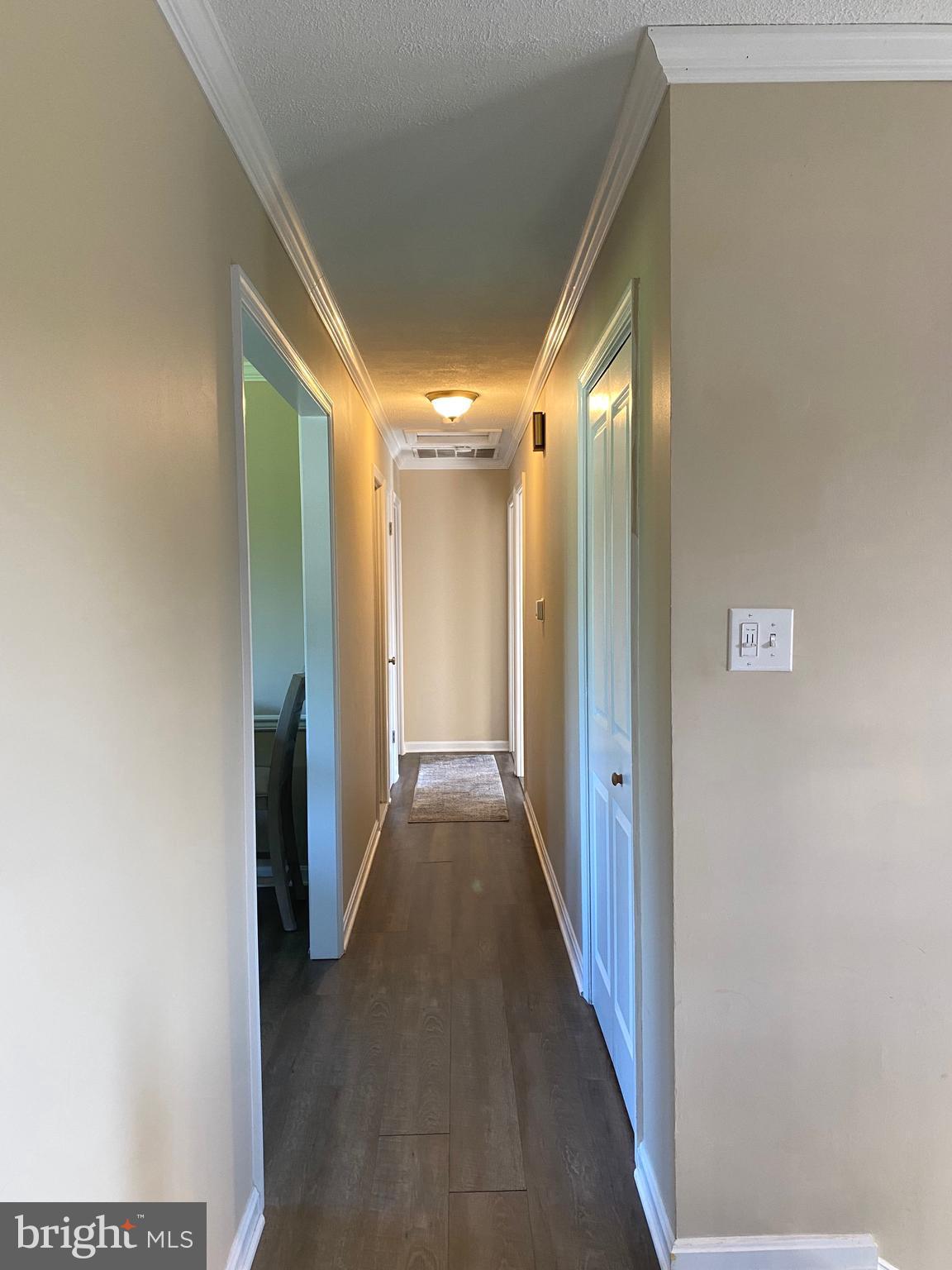 37715 Apache Road Charlotte Hall, MD 20622 - Photo 10 of 35 a view of a hallway with wooden floor