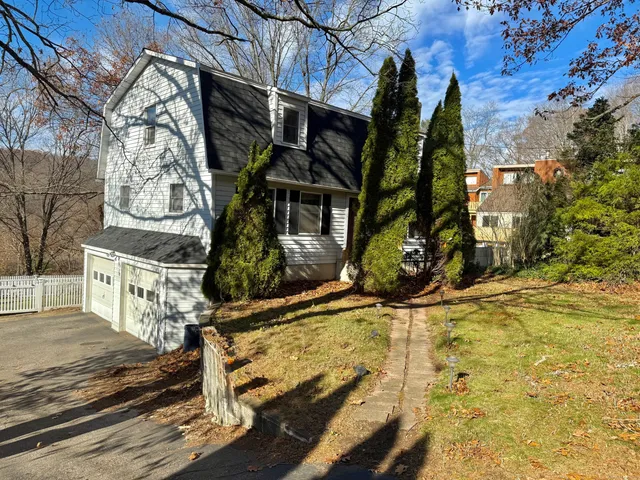 a view of house with wooden stairs