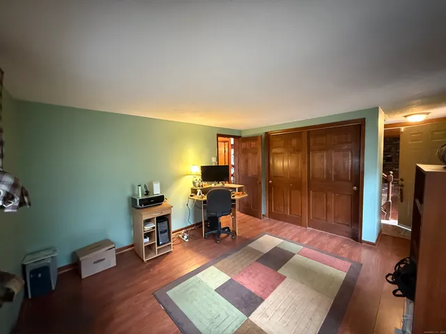 a workspace with furniture and window