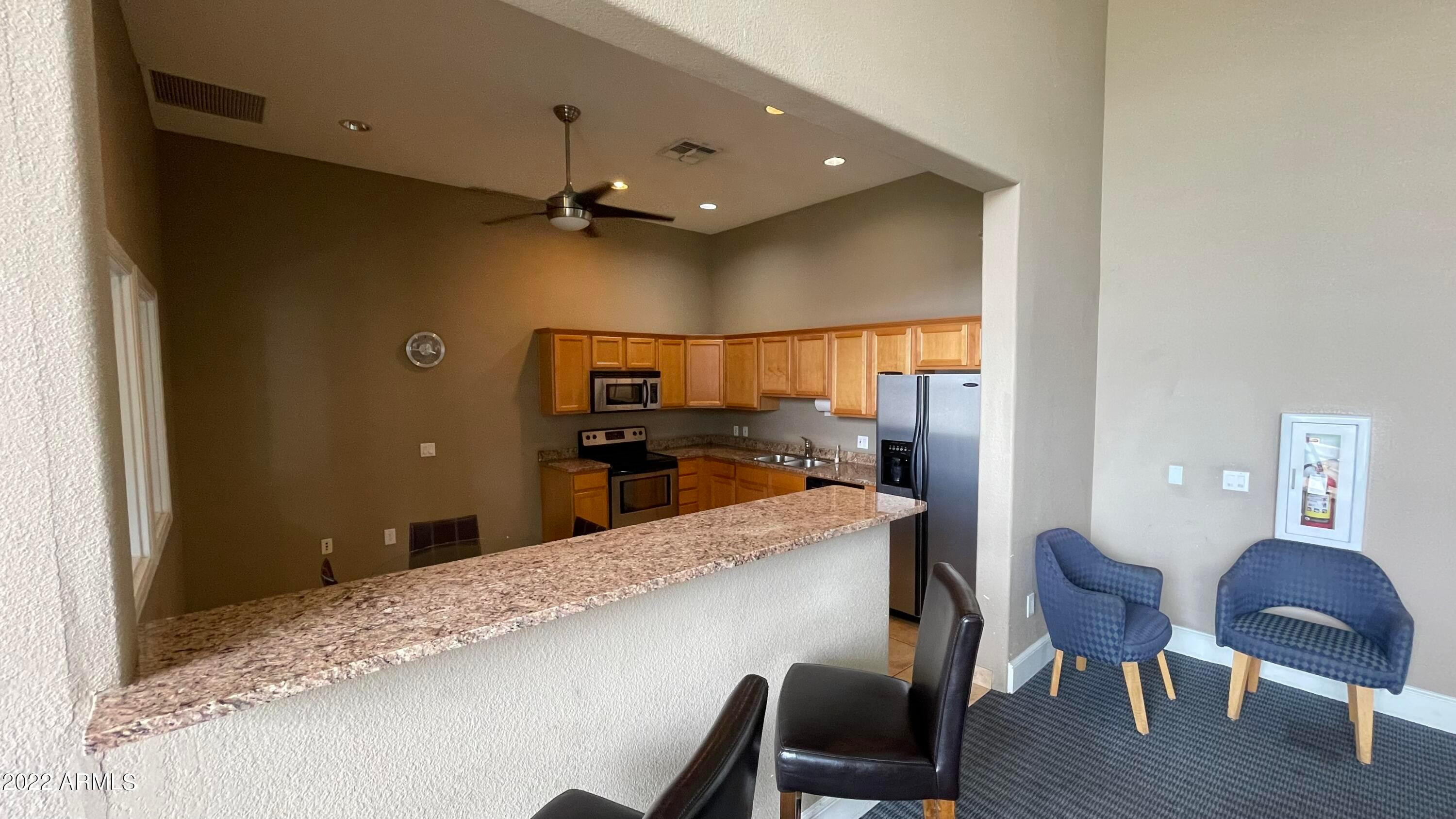 3302 North 7th Street, Unit 222 Phoenix, AZ 85014 - Photo 23 of 30 a kitchen with granite countertop cabinets and dining table