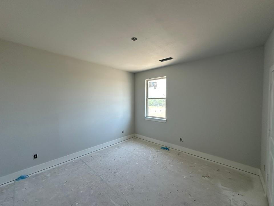 295 Brown Road Leonard, TX 75452 - Photo 21 of 26 Room featuring a window with white trim, light gray painted walls, and white baseboards