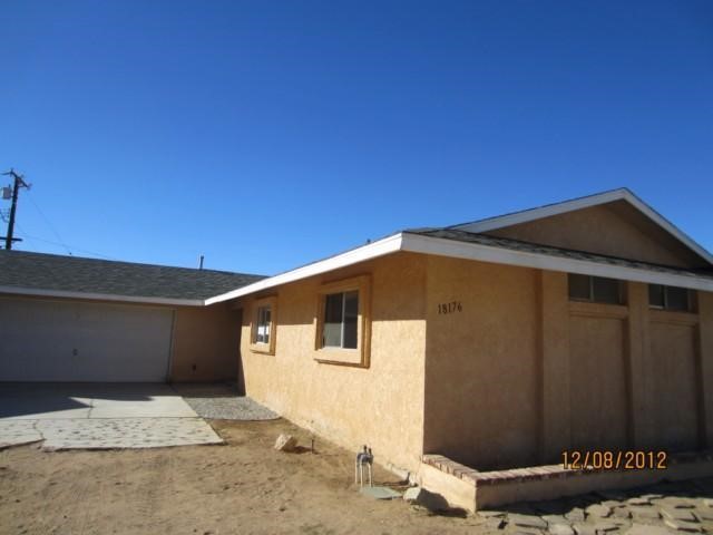 18176 Lilac Road Adelanto, CA 92301 - Photo 1 of 1 a front view of a house