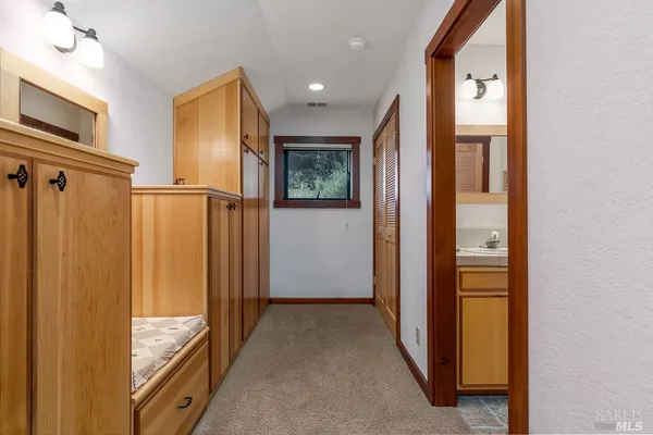 a en suite bathroom with a sink and a mirror