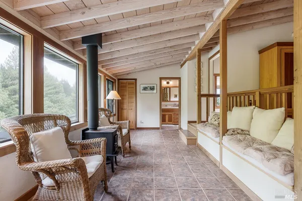 a bedroom with a bed and a lamp with the view of closet