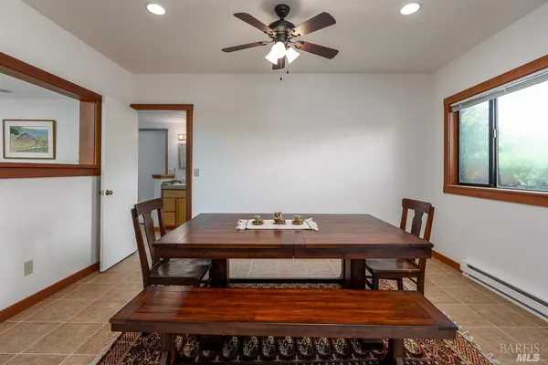 a living room with furniture and a book shelf