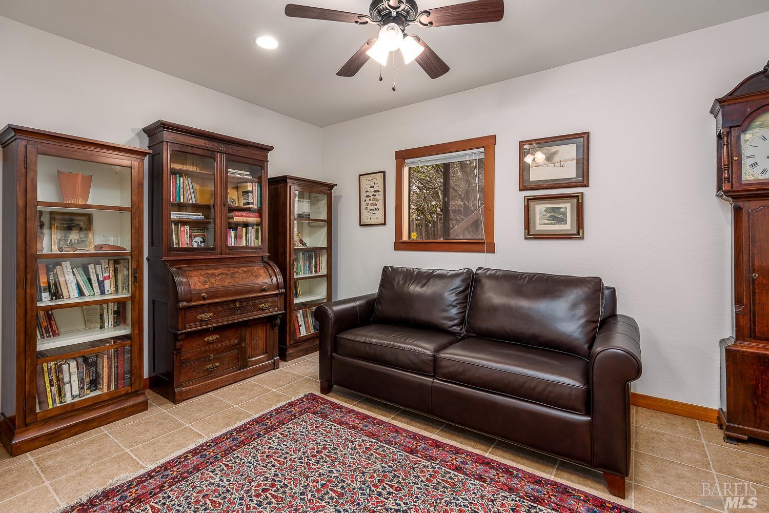2151 Guntly Road Philo, CA 95466 - Photo 33 of 43 a living room with furniture and a book shelf