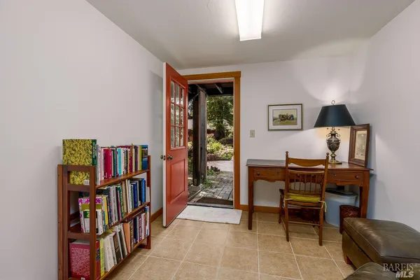 a living room with furniture and large window
