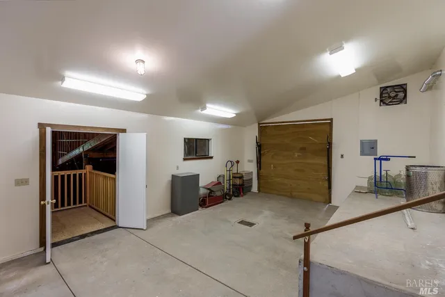 an aerial view of a house with a big yard