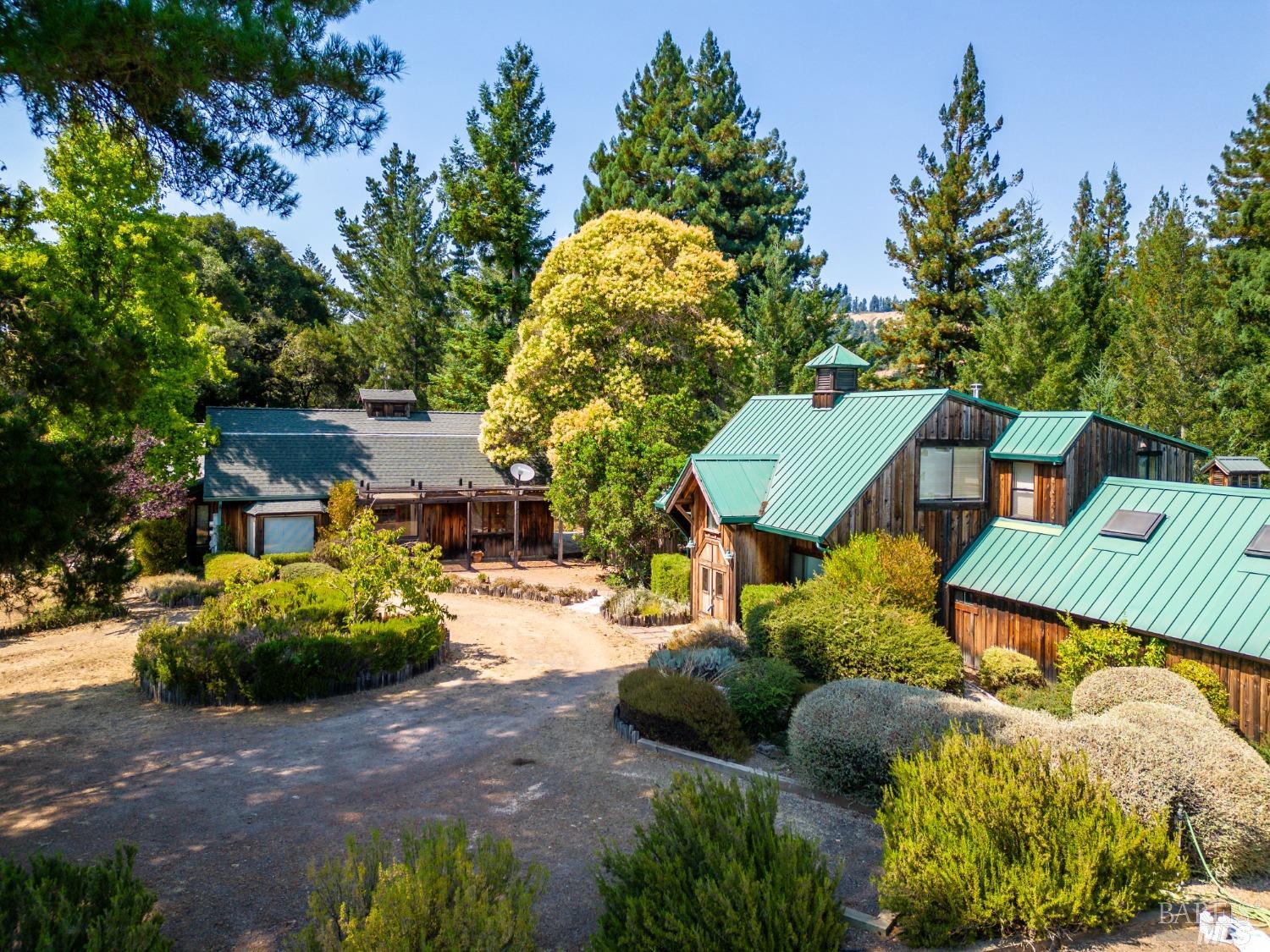2151 Guntly Road Philo, CA 95466 - Photo 4 of 43 a front view of a house with a yard and fountain