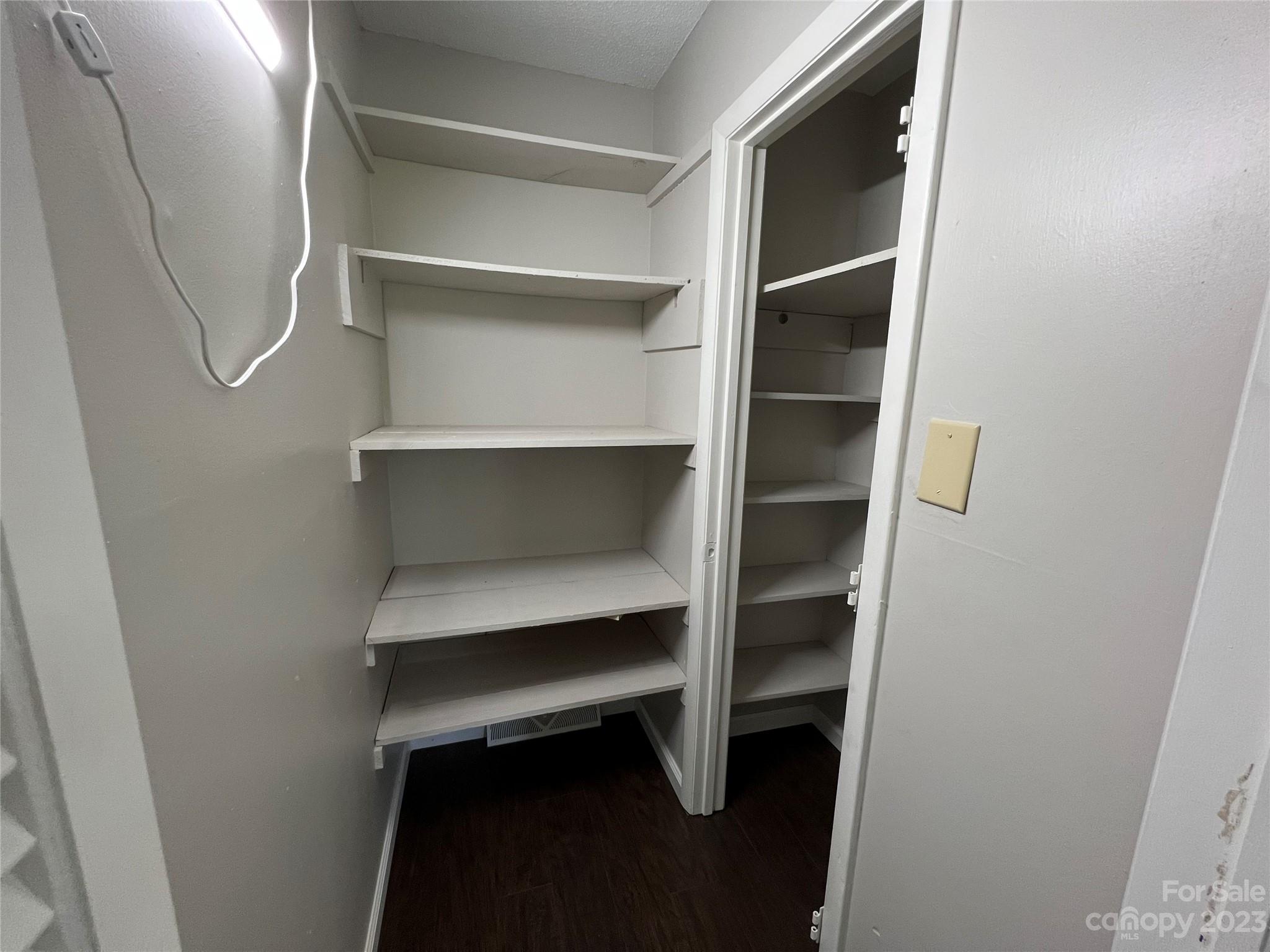 590 Hog Pen Branch Road Mooresboro, NC 28114 - Photo 12 of 36 a view of walk in closet with empty racks