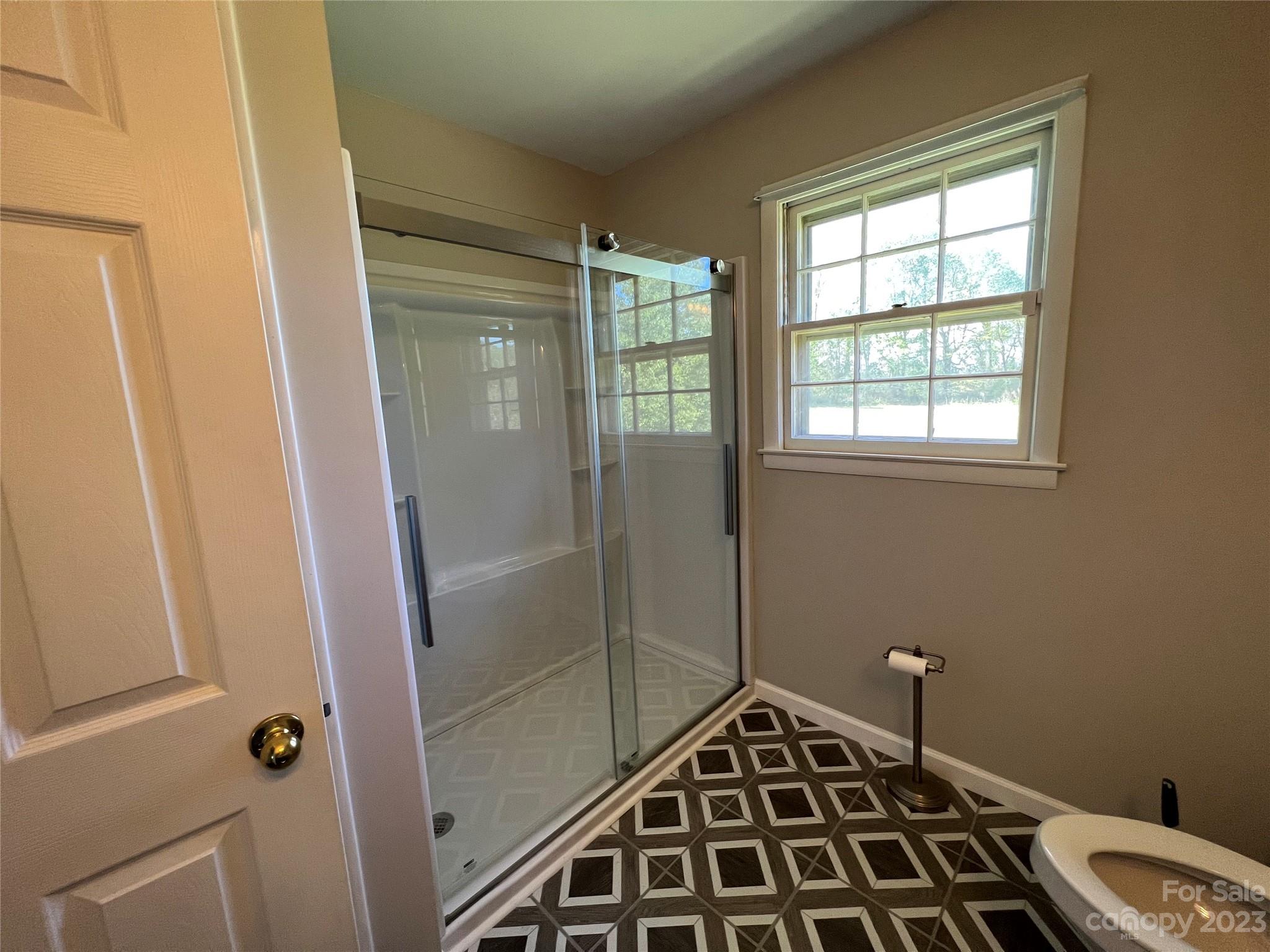 590 Hog Pen Branch Road Mooresboro, NC 28114 - Photo 16 of 36 a bathroom with a sink and a shower