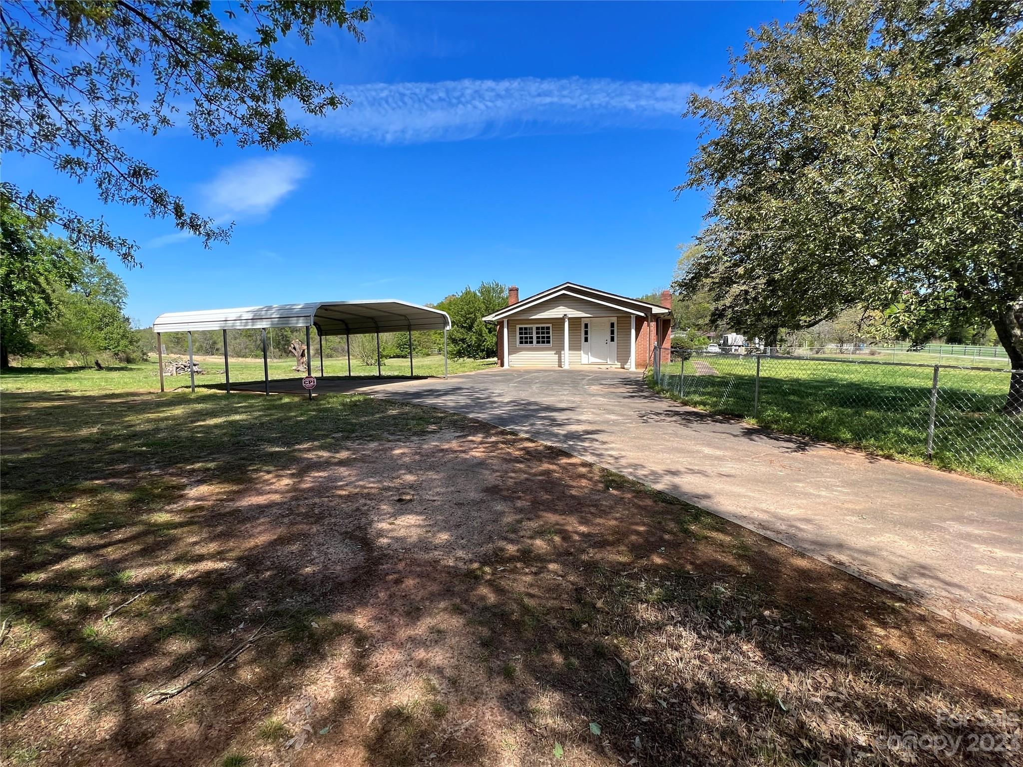590 Hog Pen Branch Road Mooresboro, NC 28114 - Photo 2 of 36 a view of an house with backyard and trees