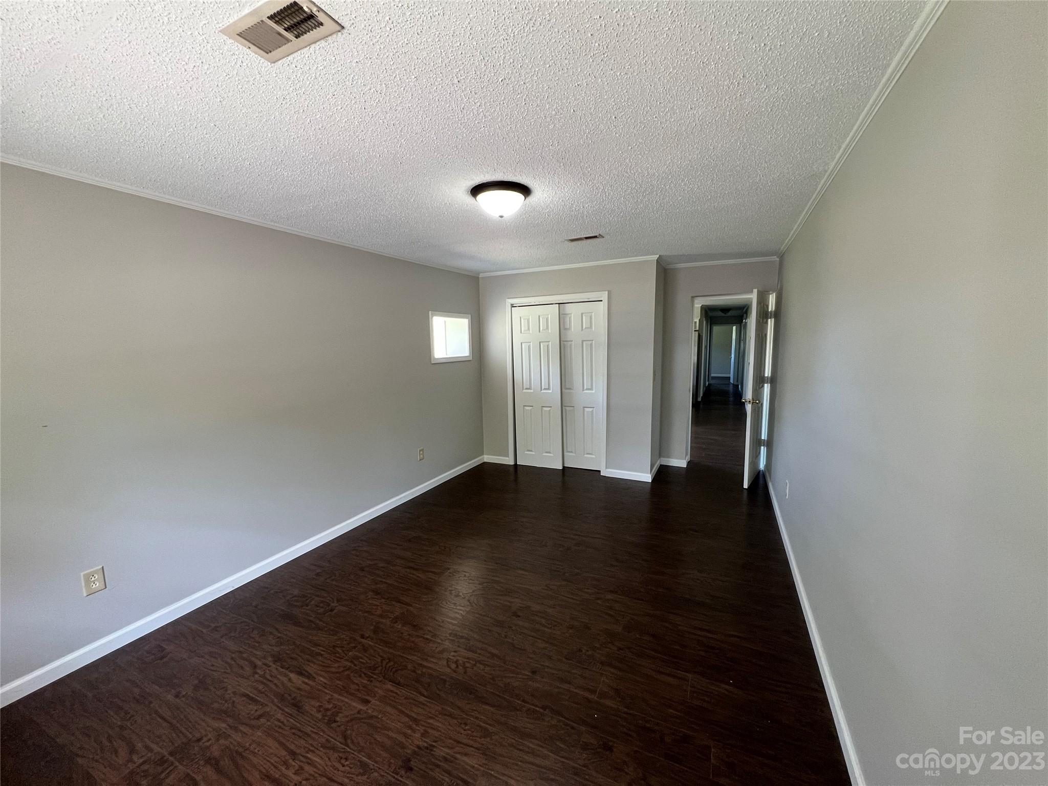 590 Hog Pen Branch Road Mooresboro, NC 28114 - Photo 23 of 36 wooden floor in an empty room with a window