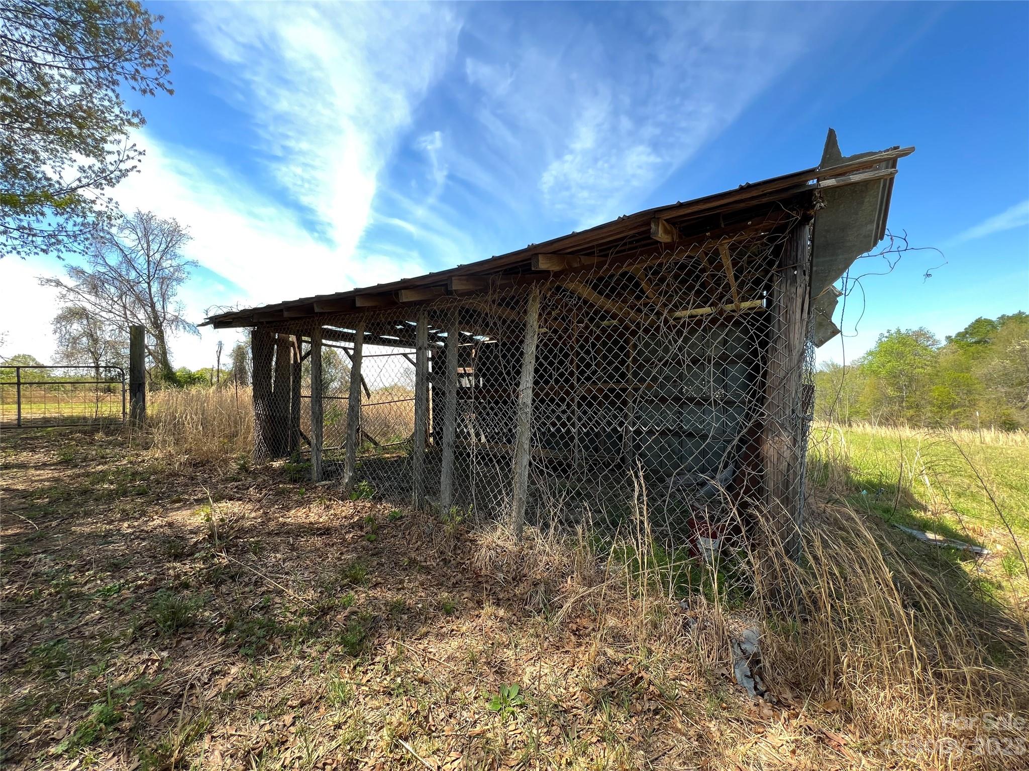 590 Hog Pen Branch Road Mooresboro, NC 28114 - Photo 32 of 36 a backyard of a house with lots of green space