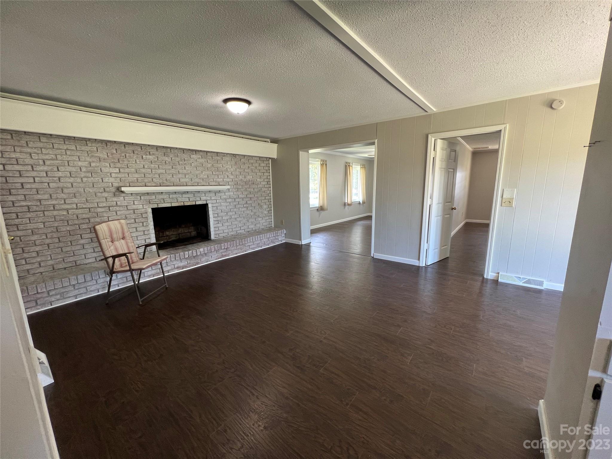 590 Hog Pen Branch Road Mooresboro, NC 28114 - Photo 7 of 36 a view of empty room with wooden floor